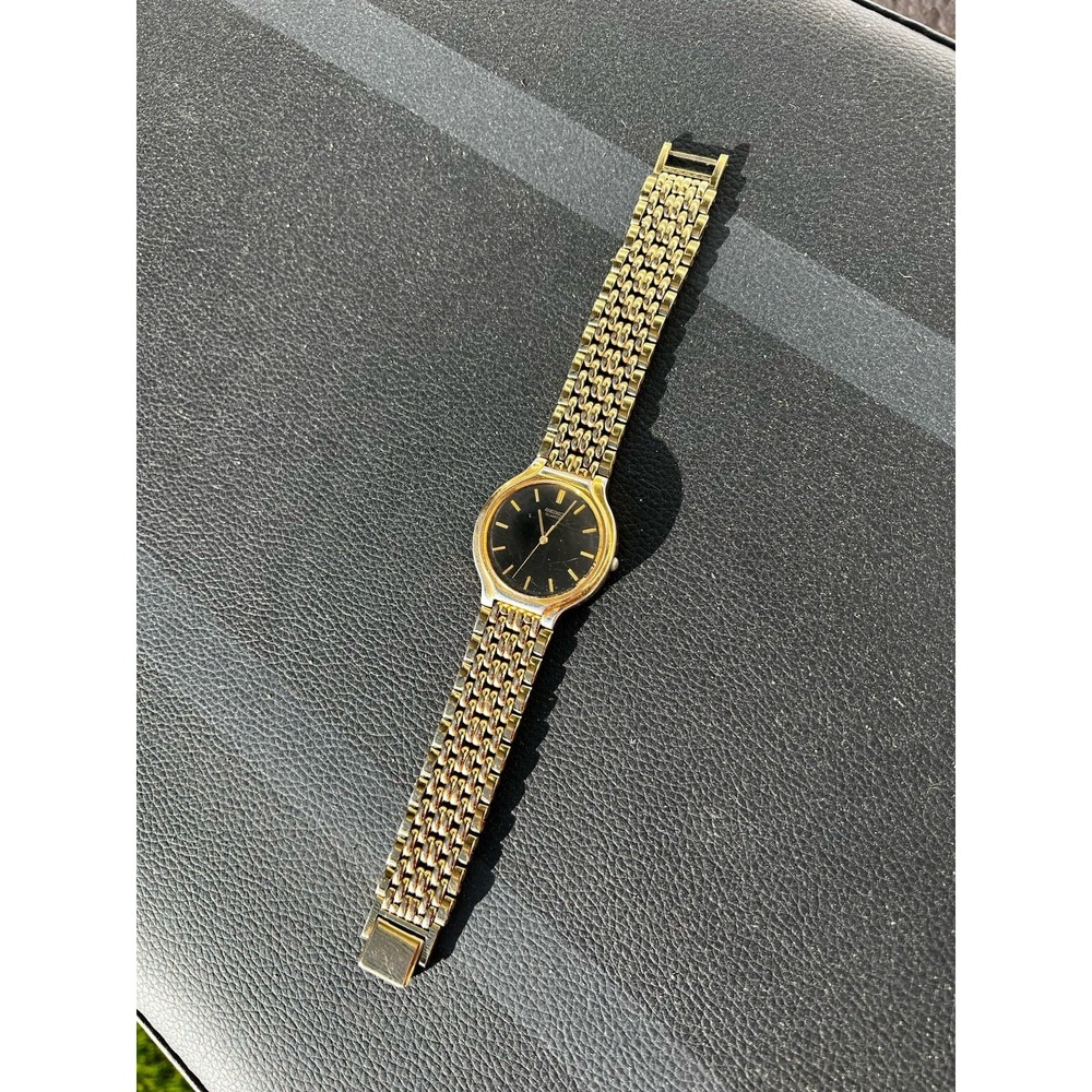 Vintage Seiko Quartz Gold Tone Dress Watch V701-6K69 Black Dial Japan